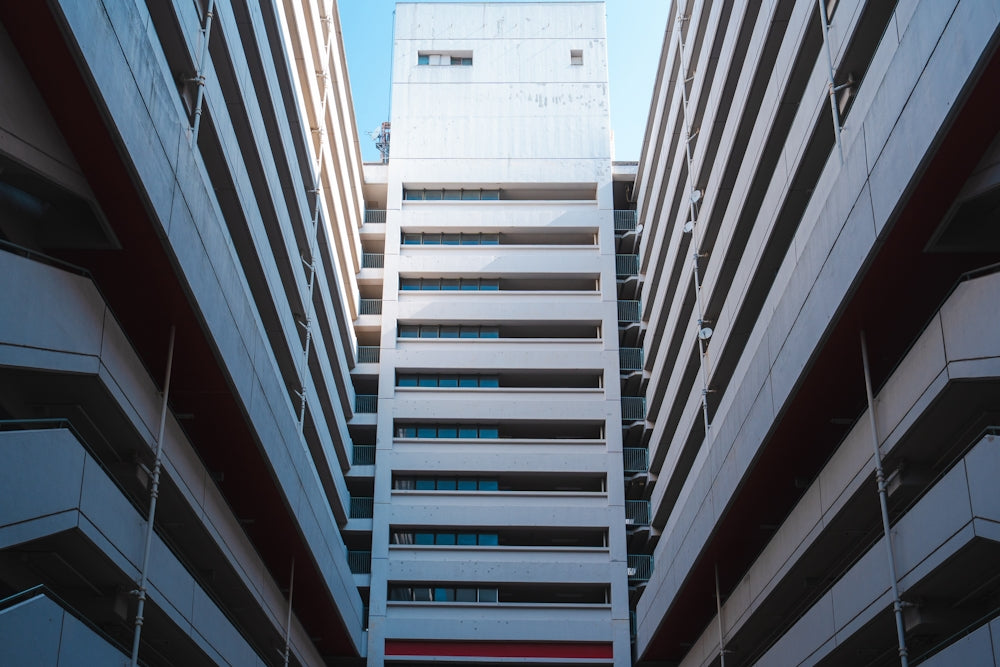 a couple of tall buildings next to each other