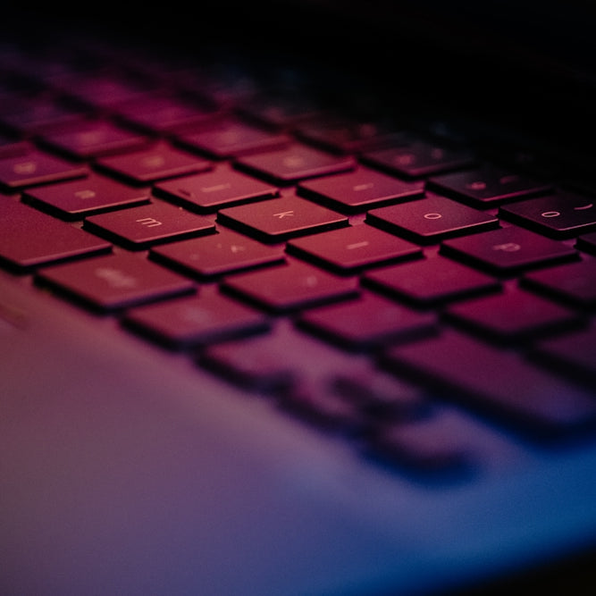 a close up of a keyboard with a blurry background