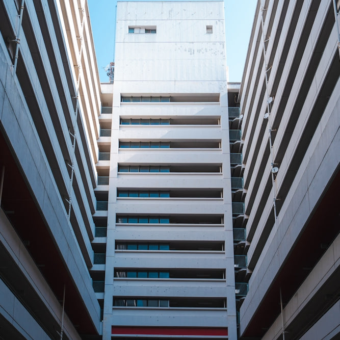 a couple of tall buildings next to each other